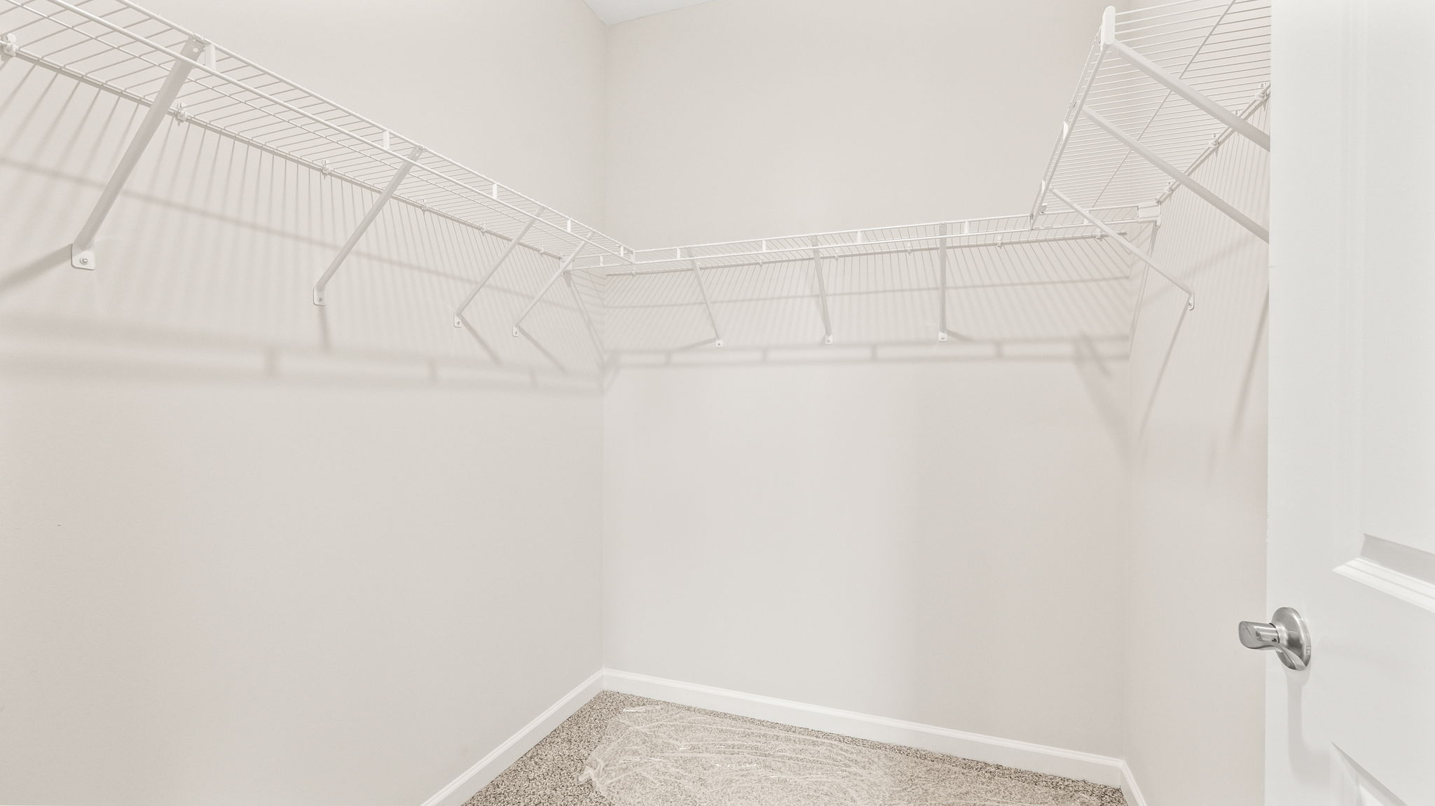 Walk-in closet with wire rack shelving