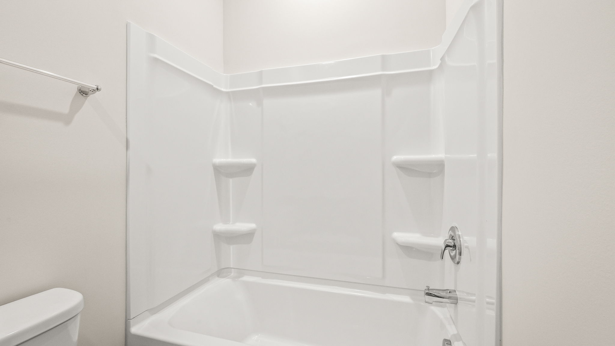 Closeup of tub with tiered shelving