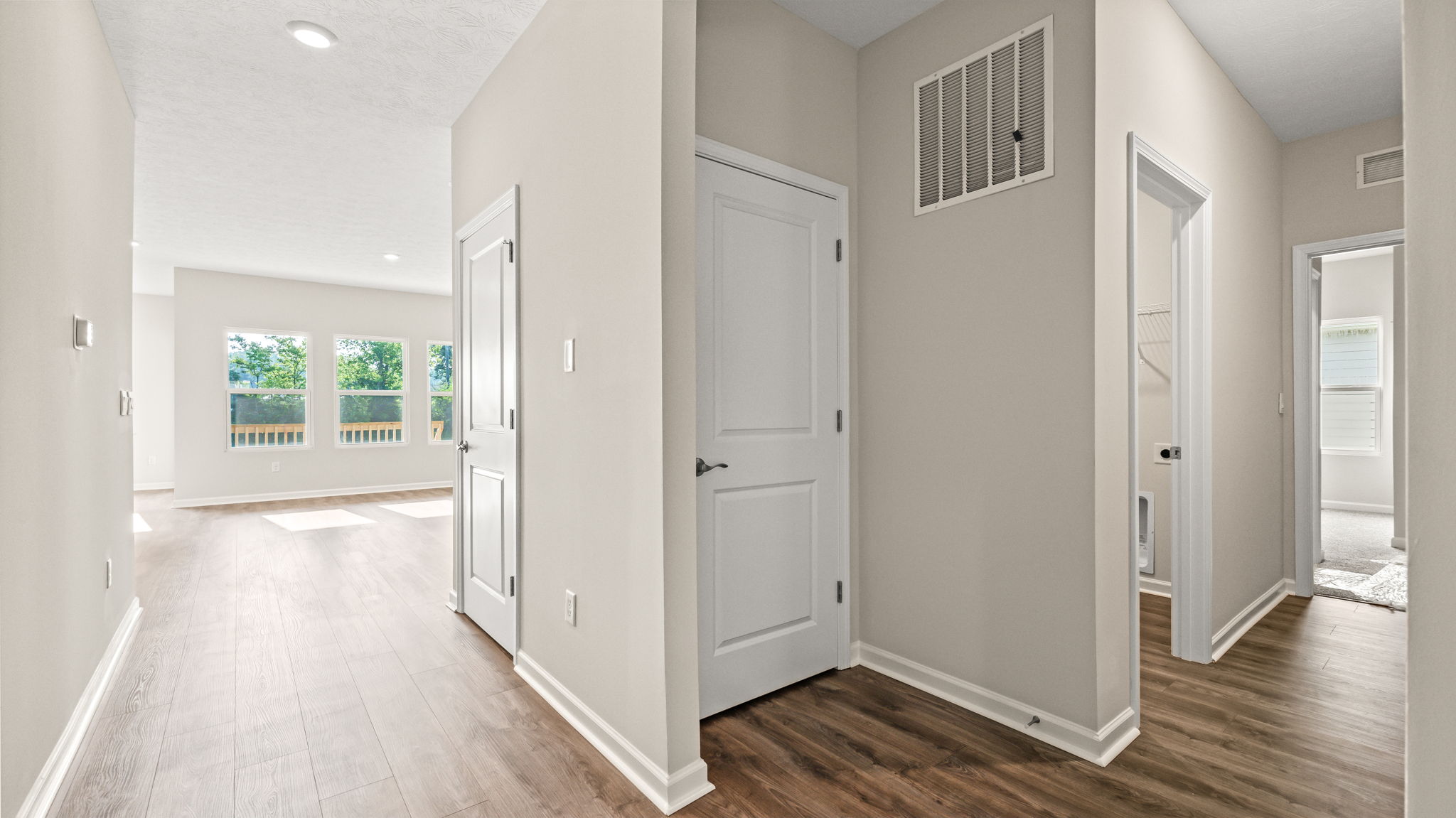 Foyer with great room and door to laundry area