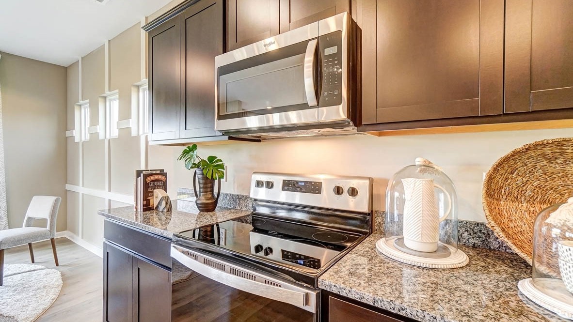 close up on kitchen countertops and whirlpool stainless steel appliances