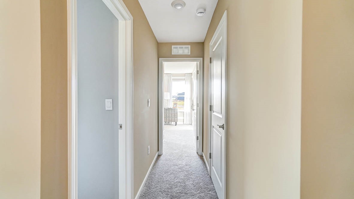 hallway with 3 doors.