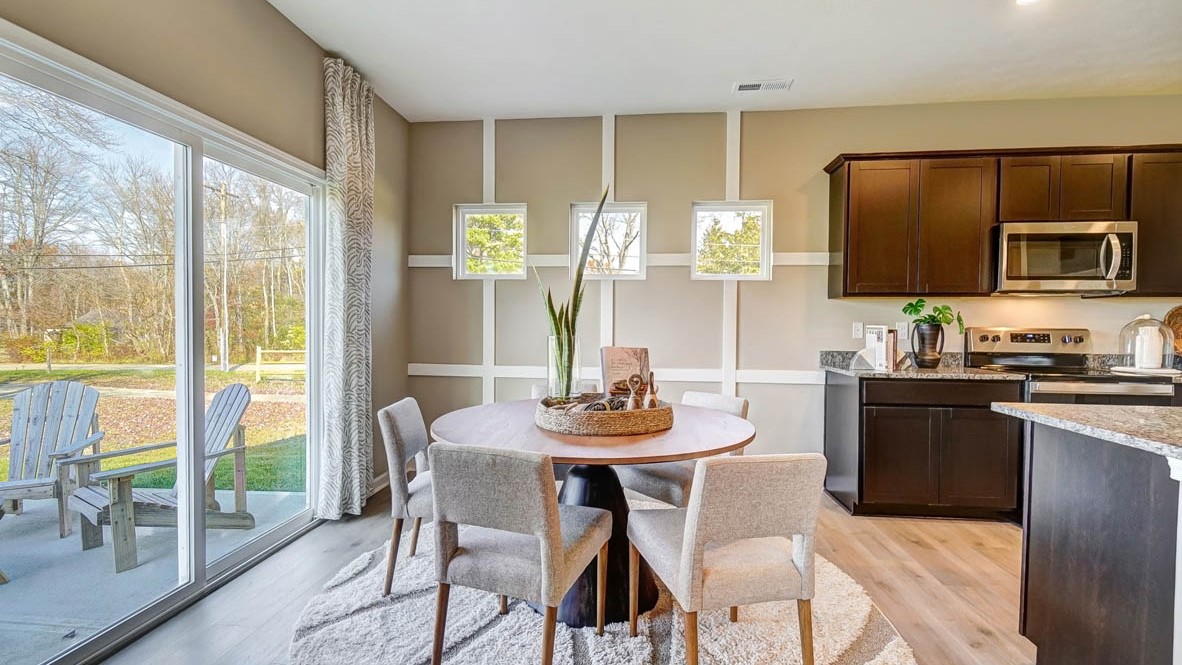 dining room with 5-person table and specialty windows