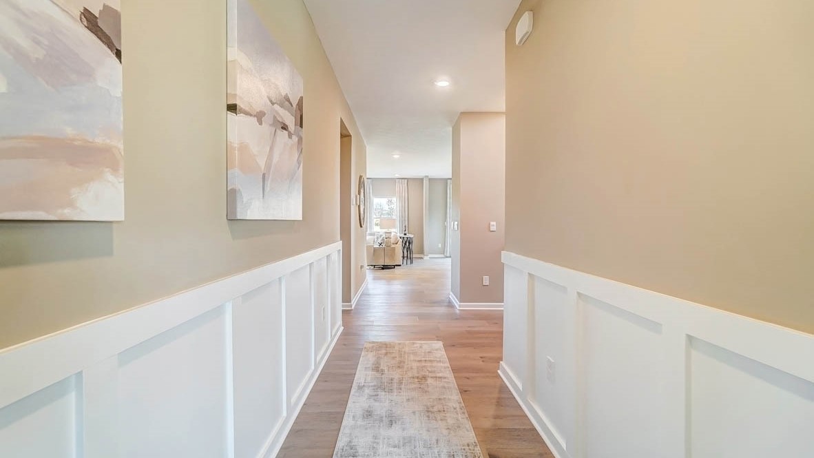 Foyer with modern art leading into great room.