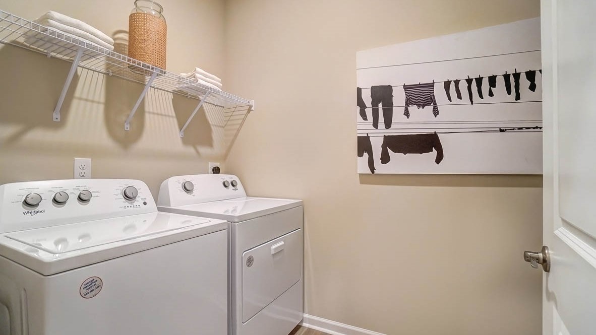 Laundry room a art on wall.