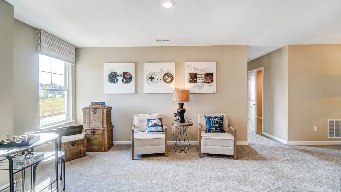 loft with chairs, modern art, and accents for games.