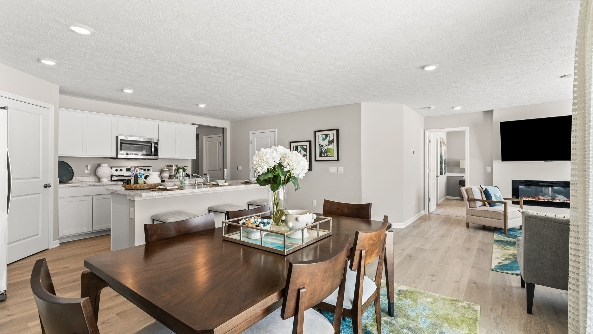 Full wide shot of dining and living room