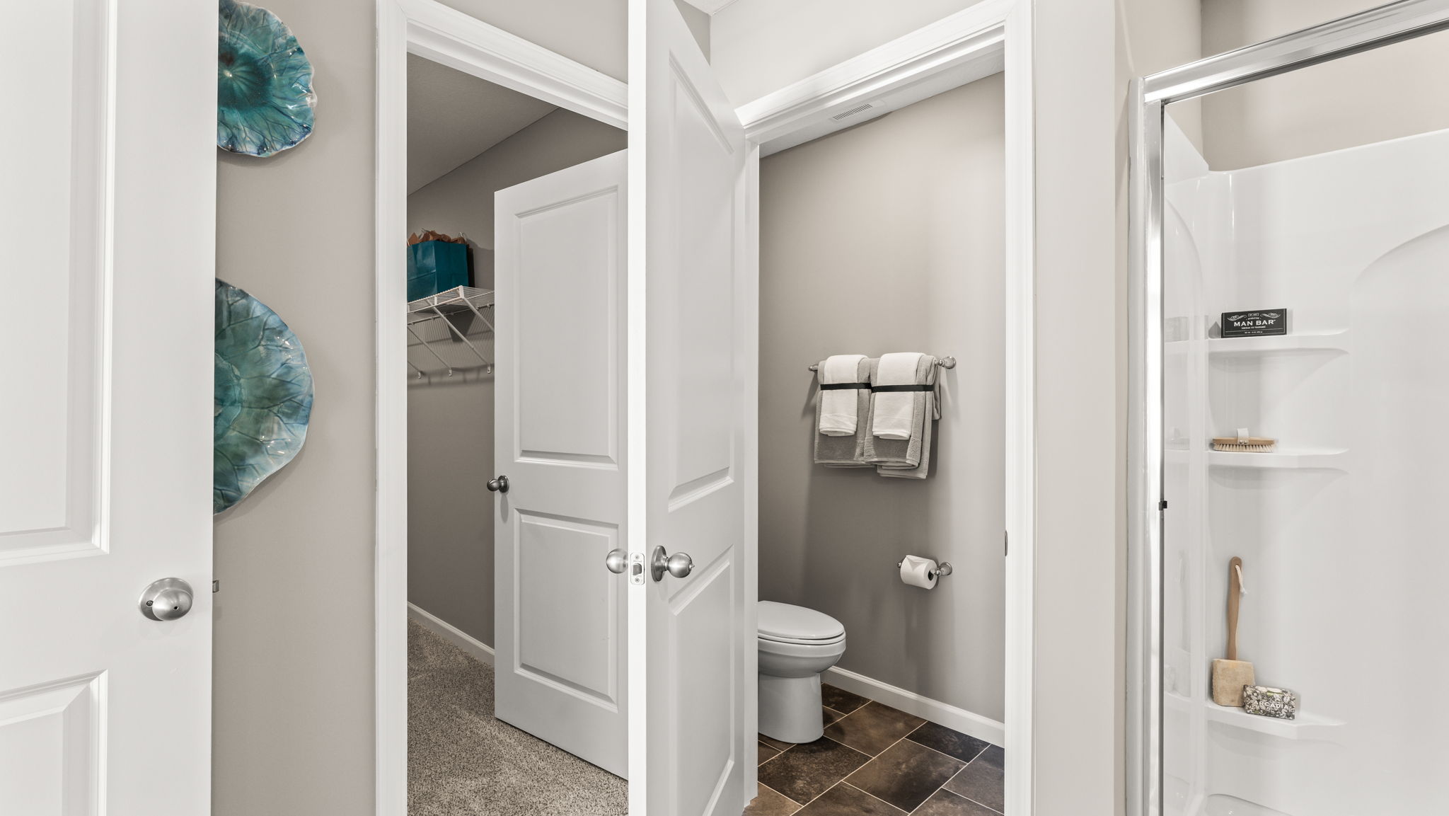 Primary suite with view of the primary bathroom