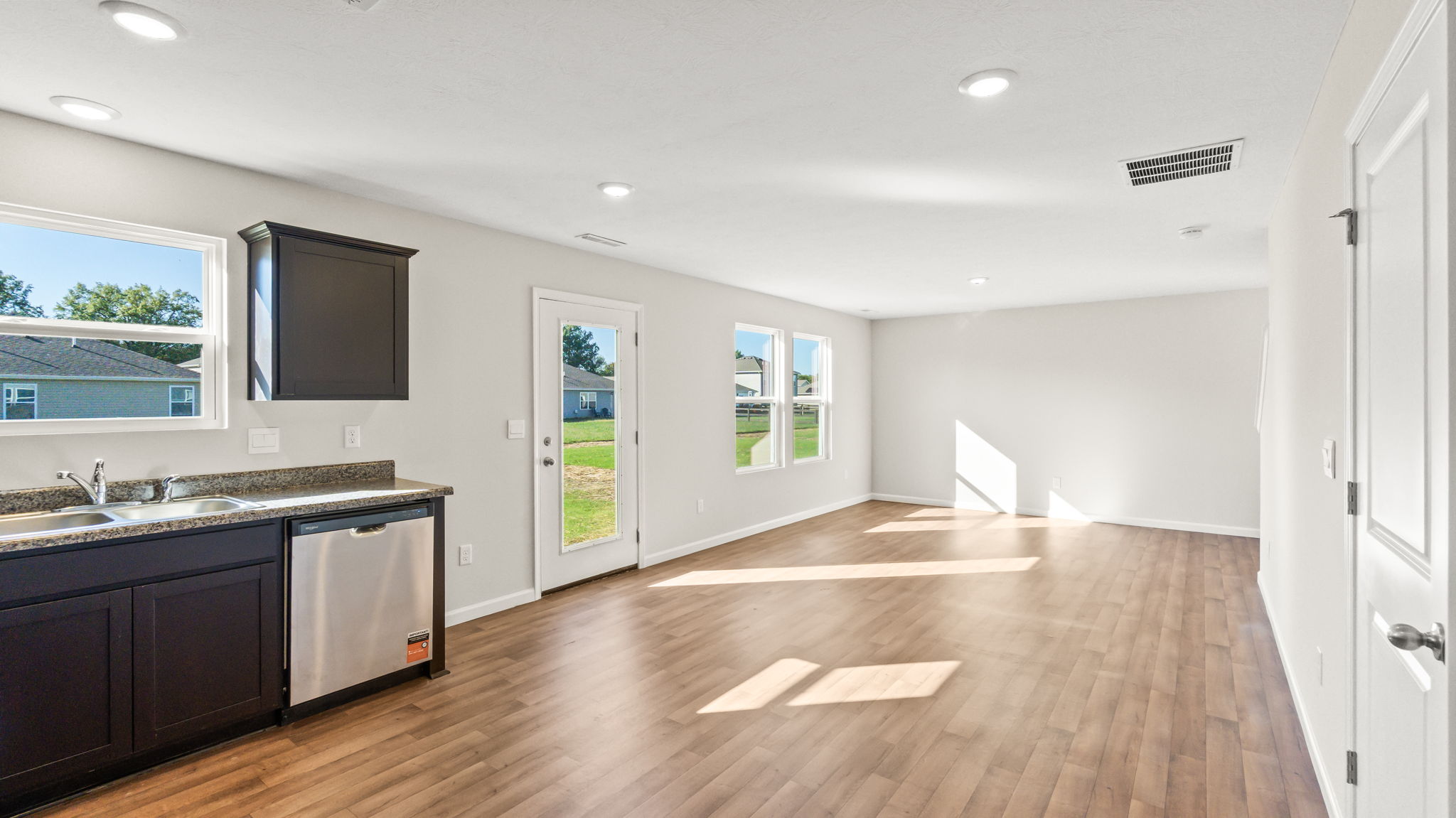 Great room with sliding door and windows