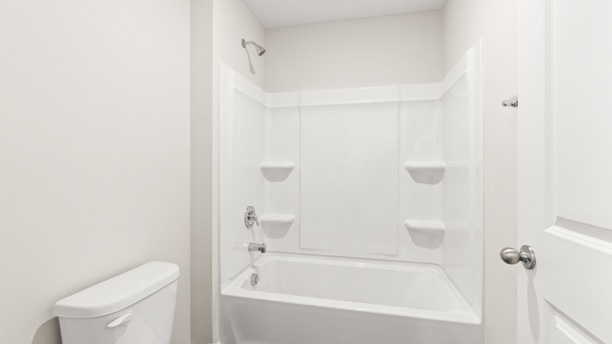 Closeup of tub with tiered shelving