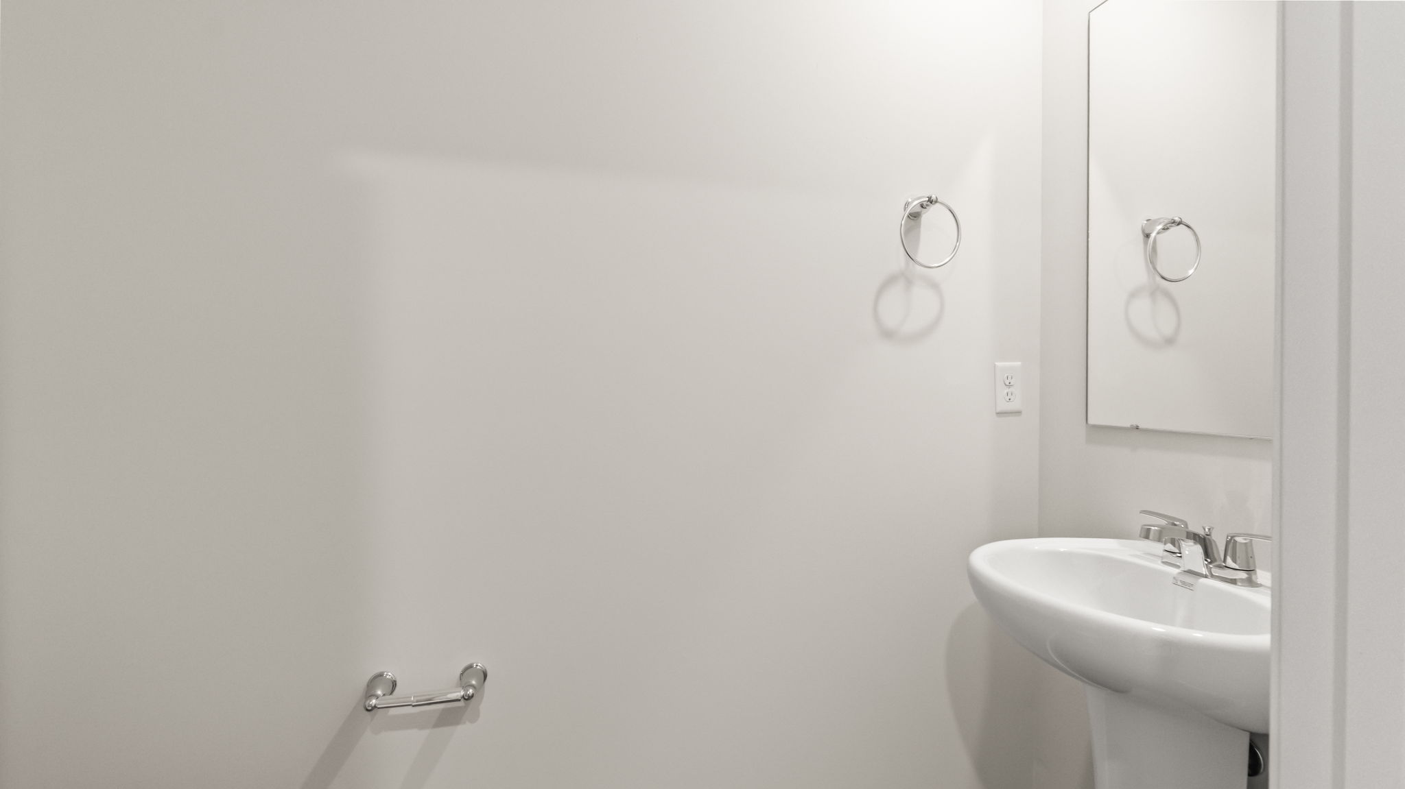 Powder room with sink and mirror