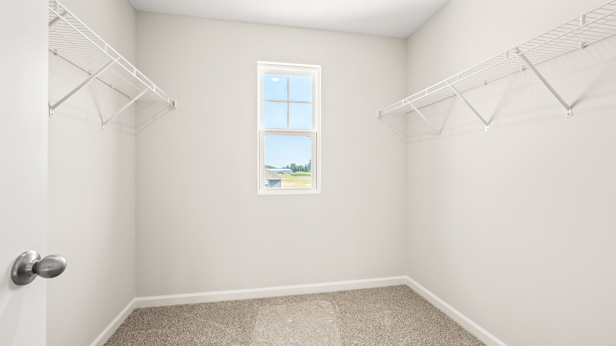 Walk-in closet with wire rack shelving
