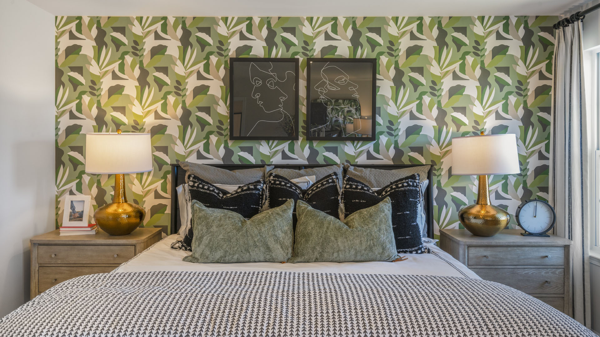 Main Bedroom with large bed, modern lamp designs, and elegant bedside tables.