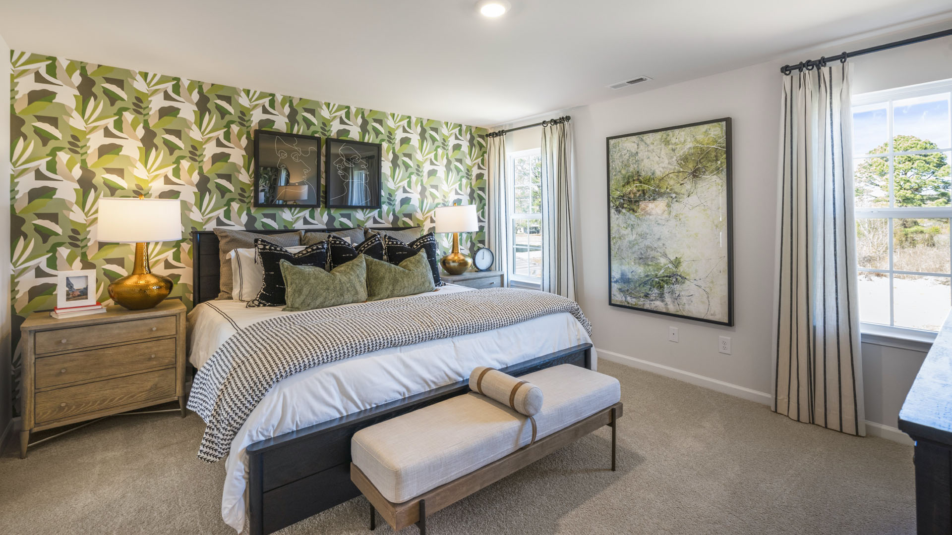 Main Bedroom with large windows , modern art throughout, and spacious design.