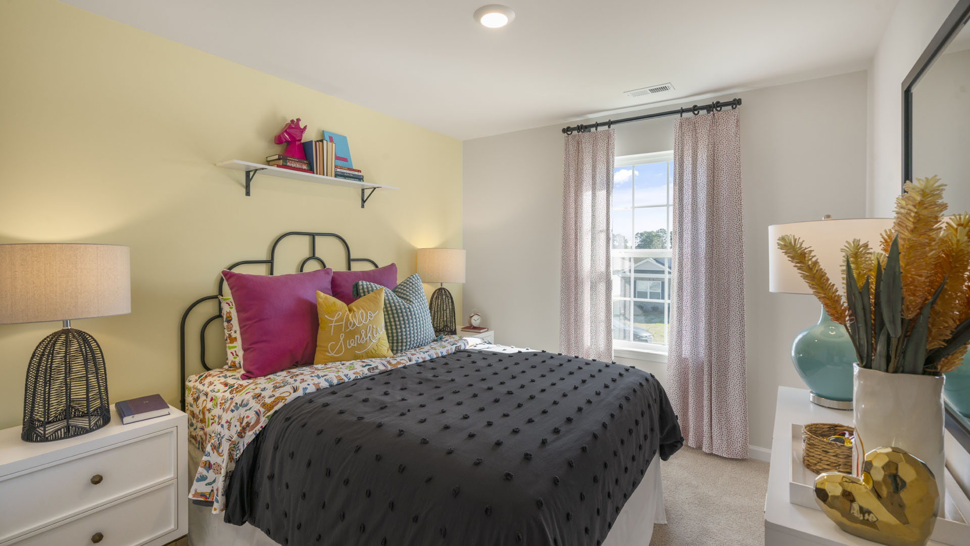 Bedroom with lush large bed, modern design touches, and large windows.