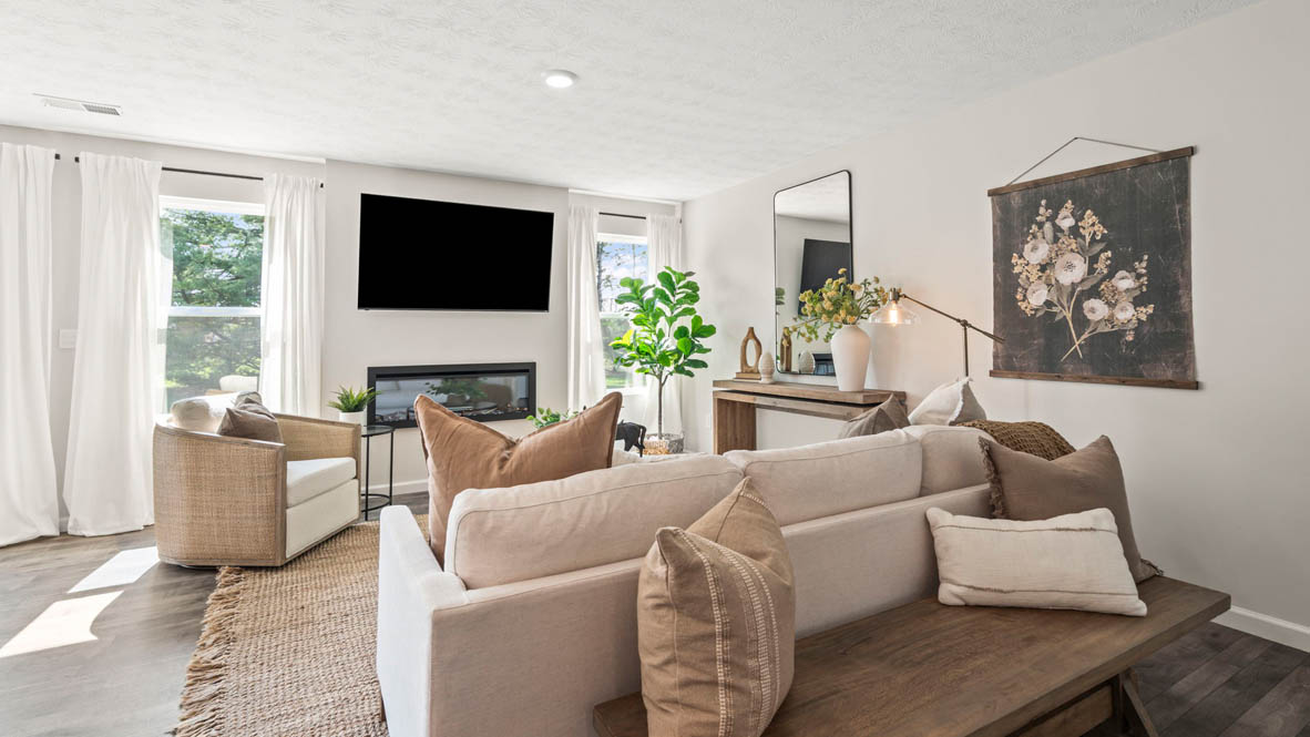 view of modern open concept living room with tv.