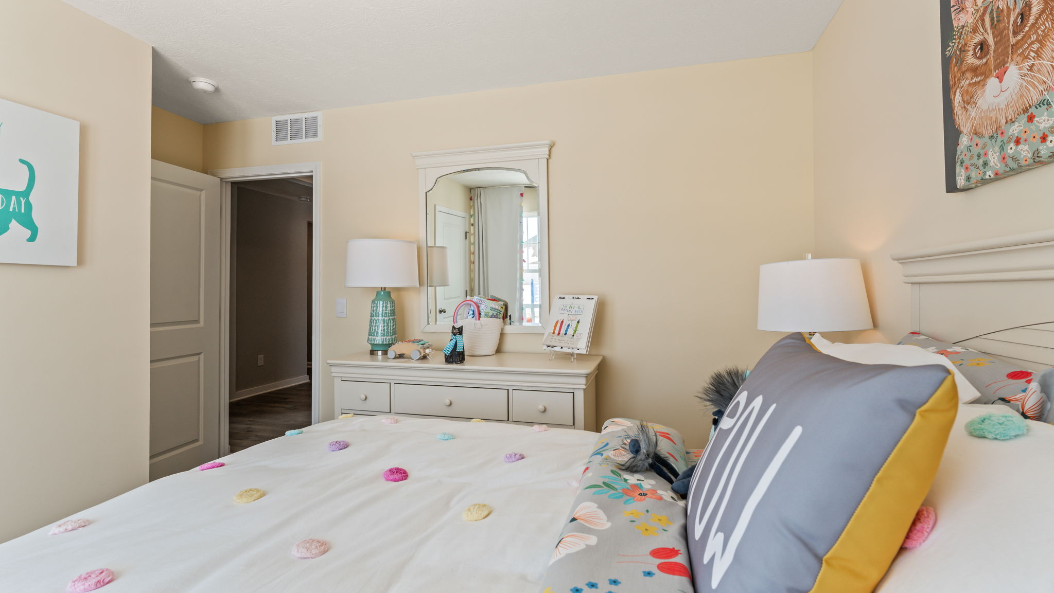 Side view of bedroom with light airy paint and tone