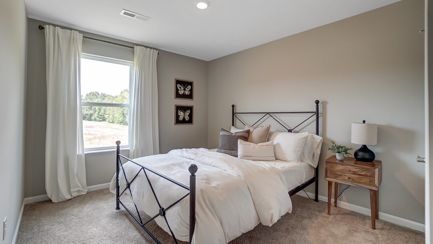 Bedroom 2 with beautiful bed and modern art.