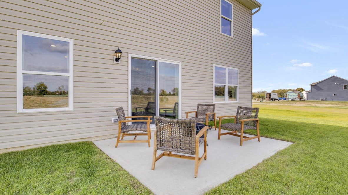 Exterior of home with concrete patio