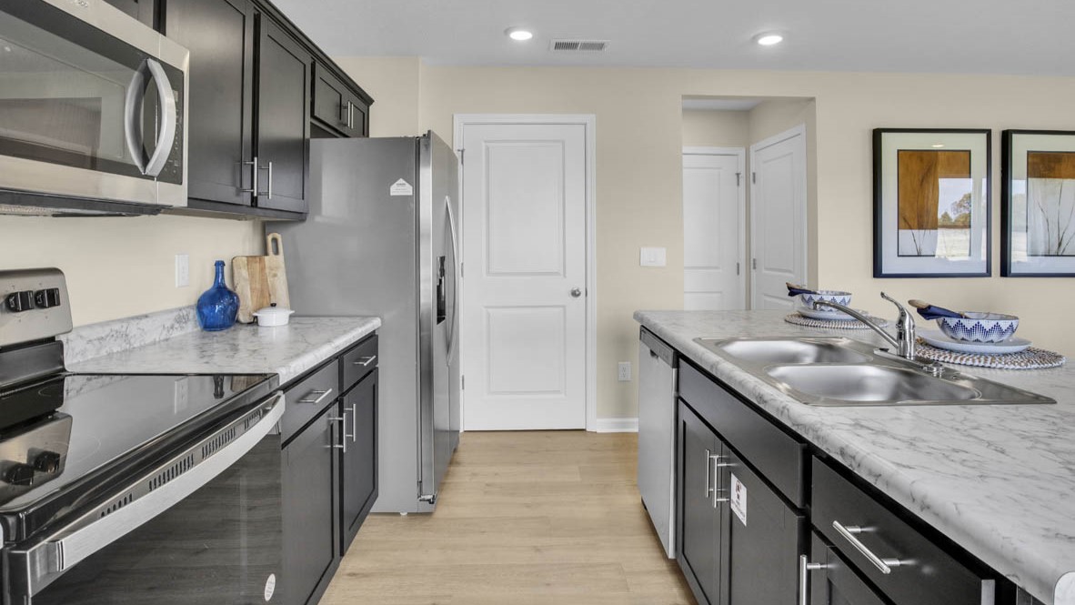 Side view of kitchen with laminate countertops