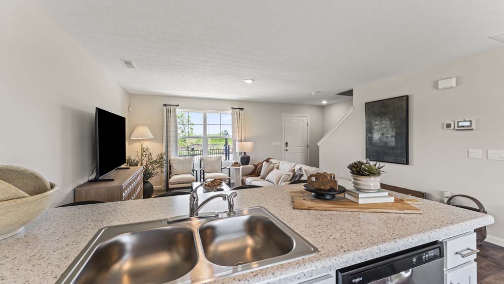 View from the kitchen sink of the living room and foyer