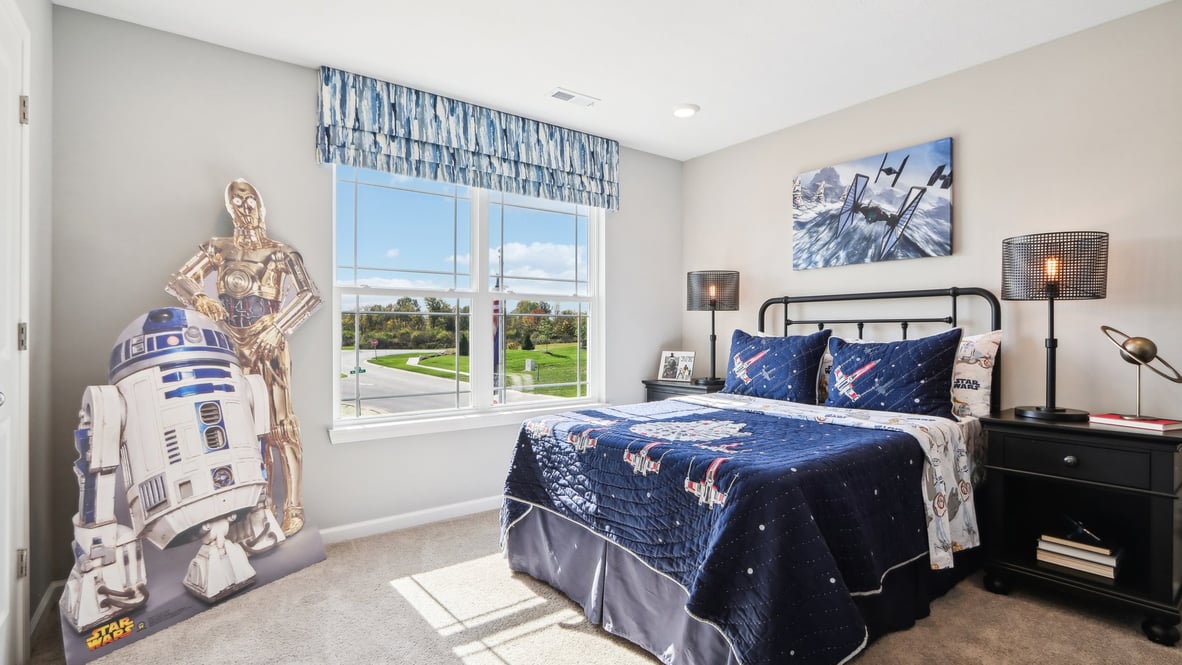 Bedroom with dark blue bedding