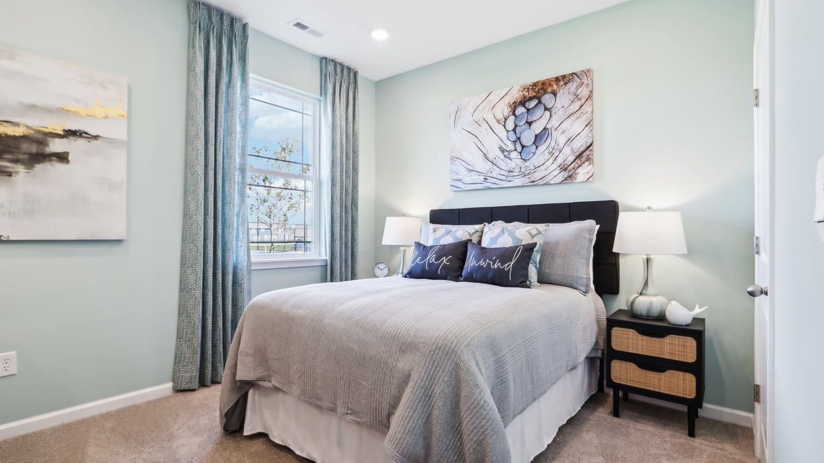 Bedroom with light blue paint/wallpaper