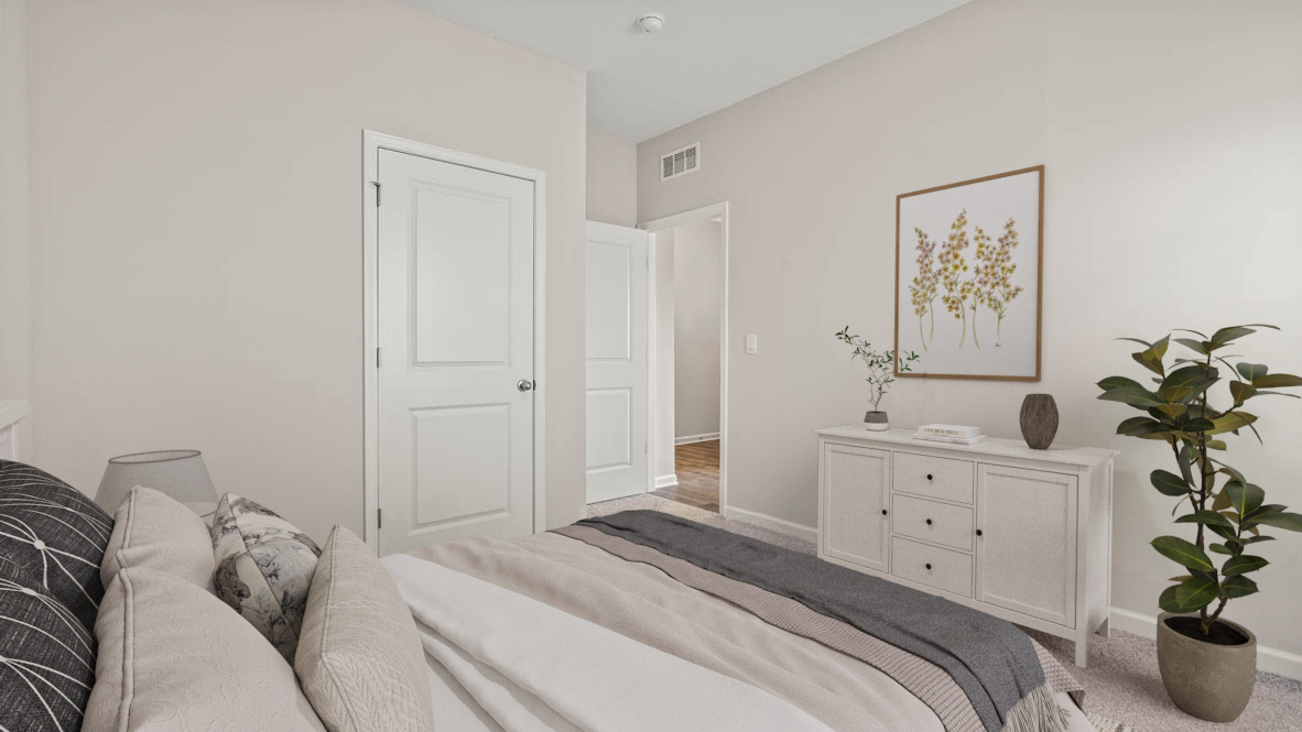3rd bedroom with white dresser and green plants.