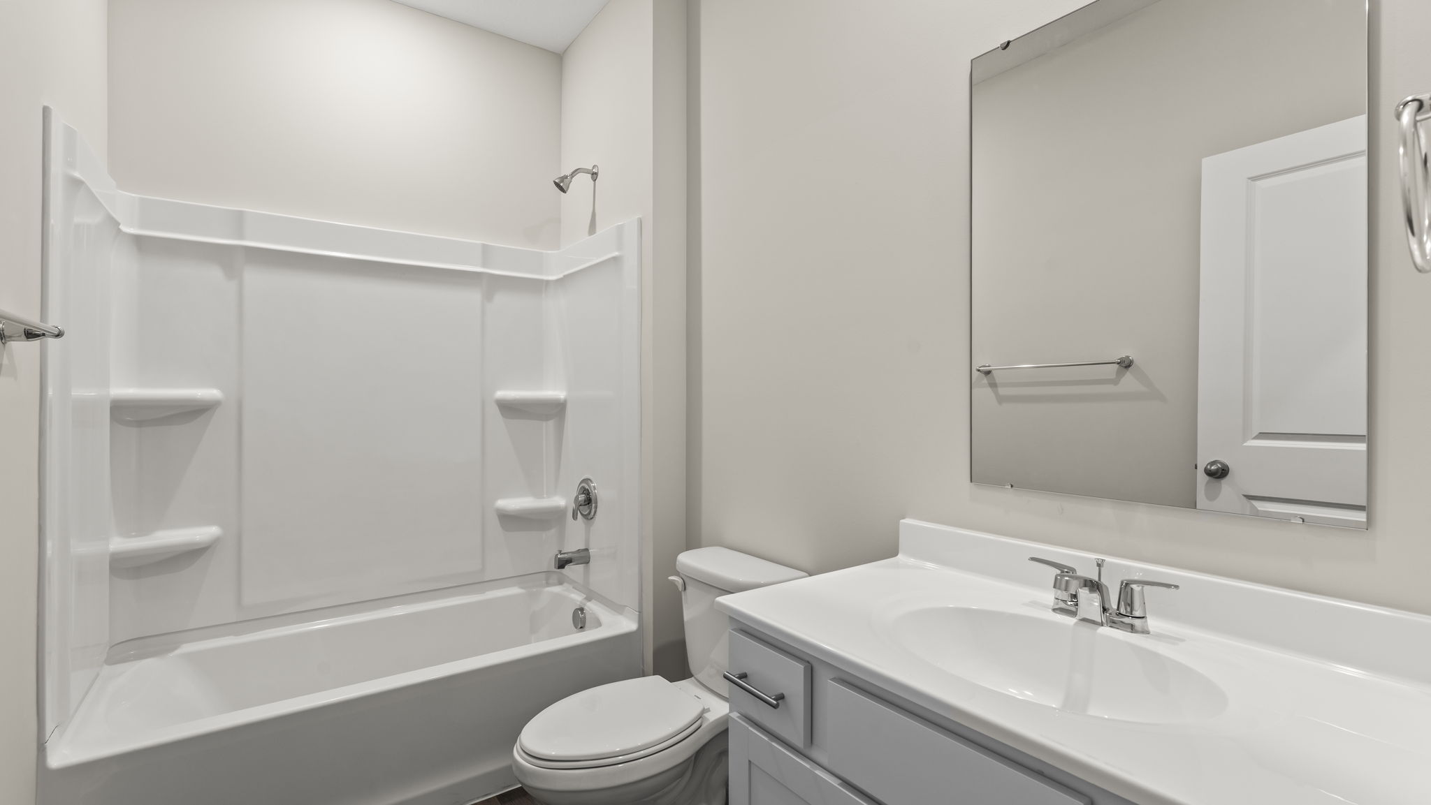 Bathroom with tub, shower, toilet, and sink.