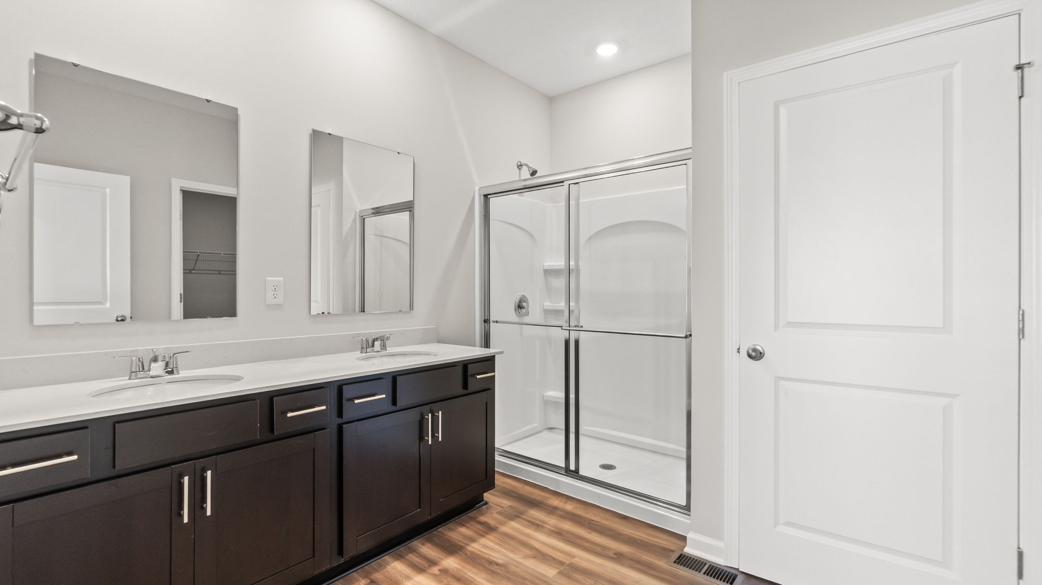 primary bathroom suite with double sink vanity