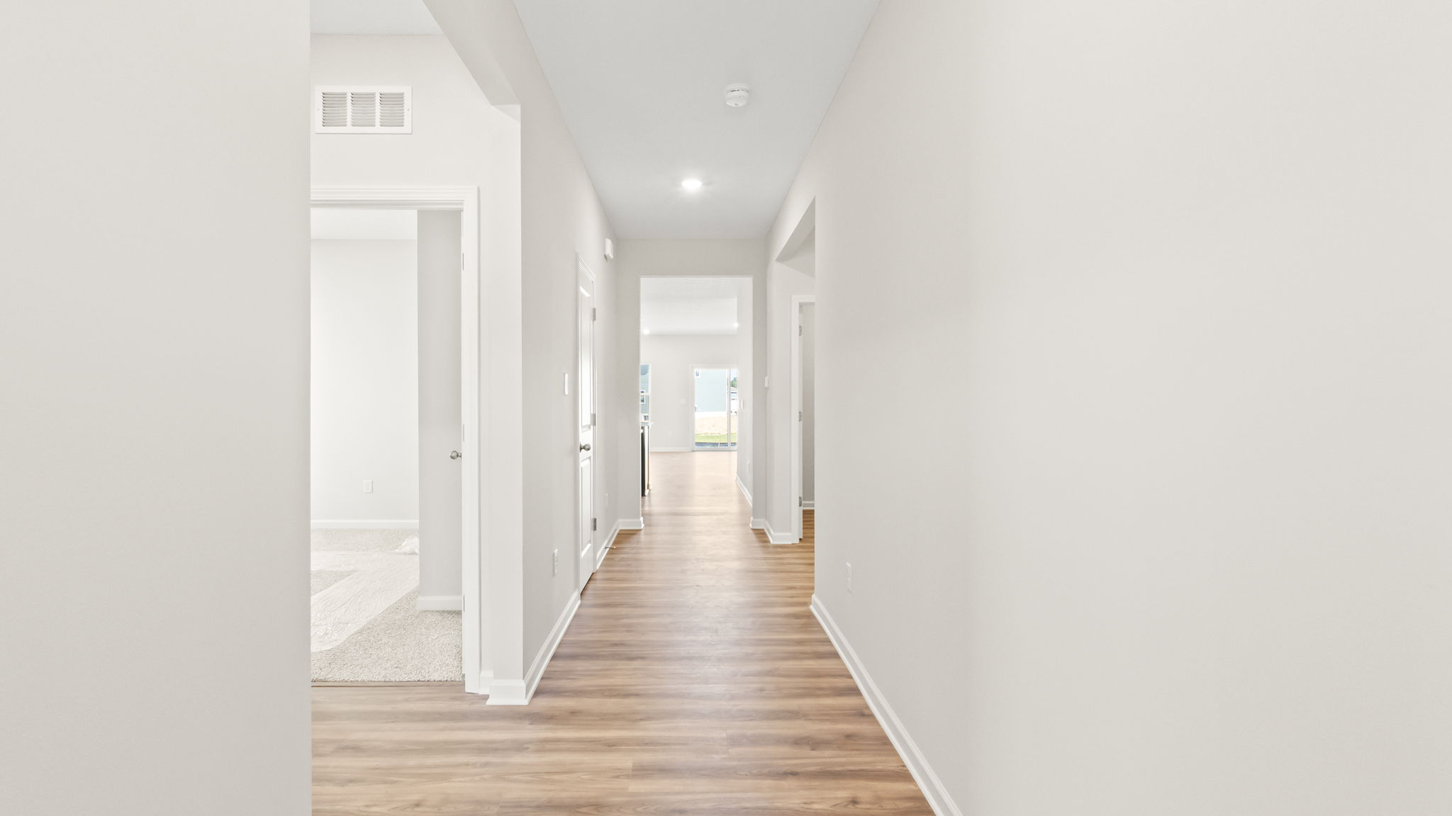 hallway leading to great room and kitchen