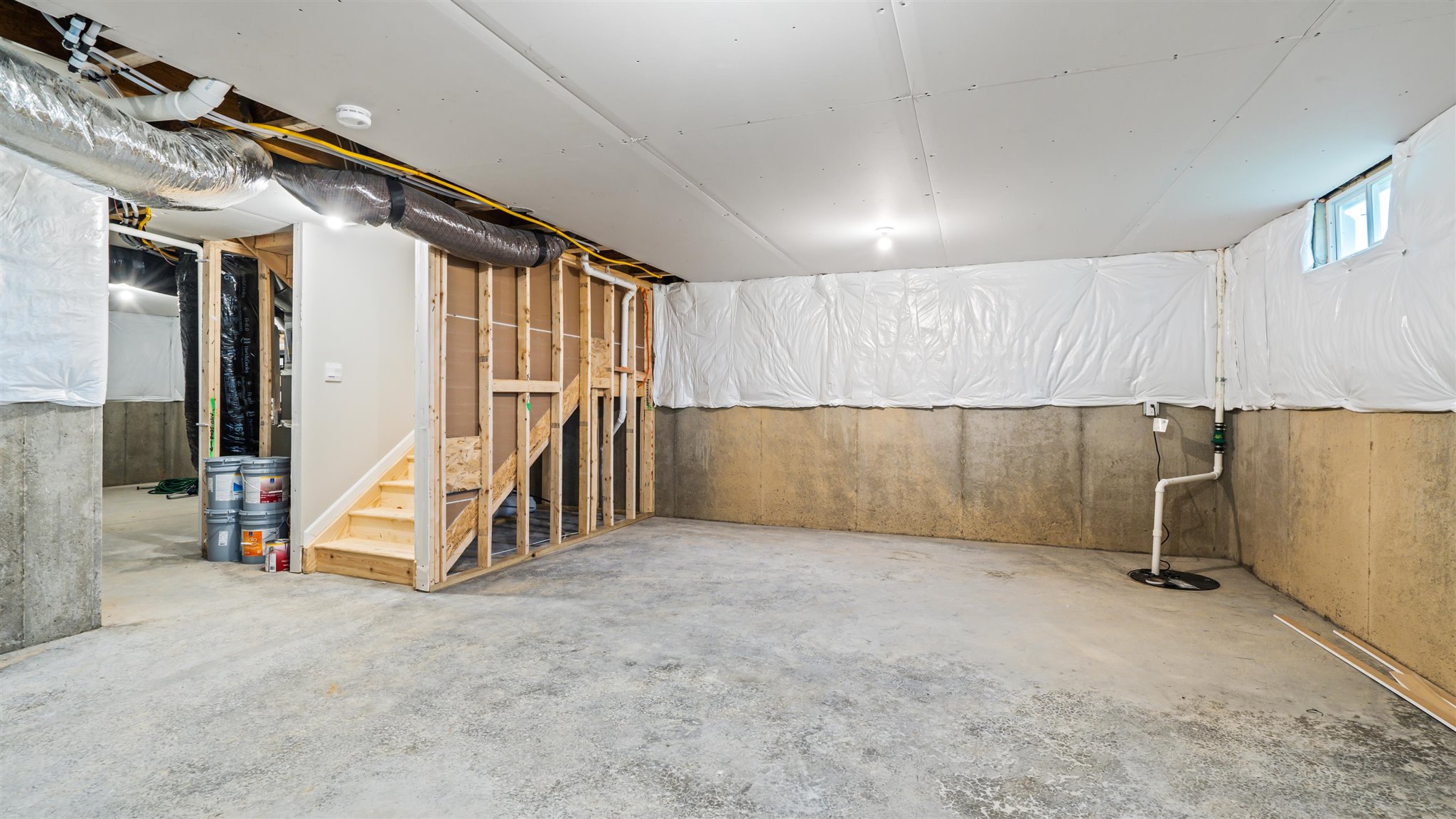 View of basement and stairs going upstairs.