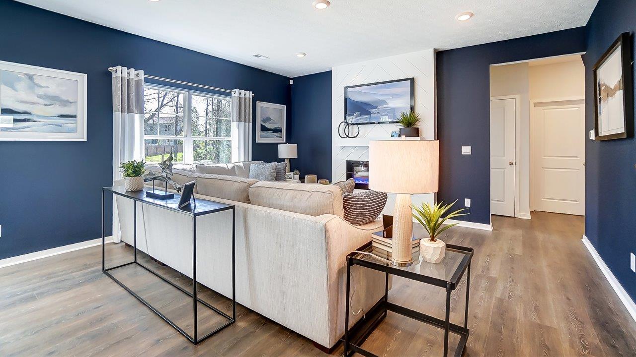 Living room with beautiful accents and large windows.