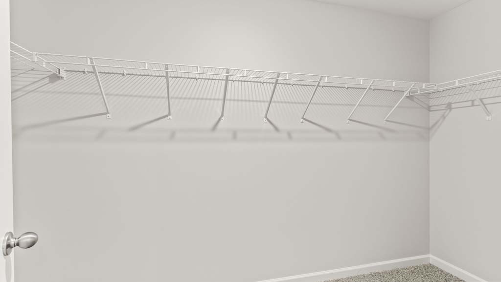 Primary bedroom closet with wire rack shelving
