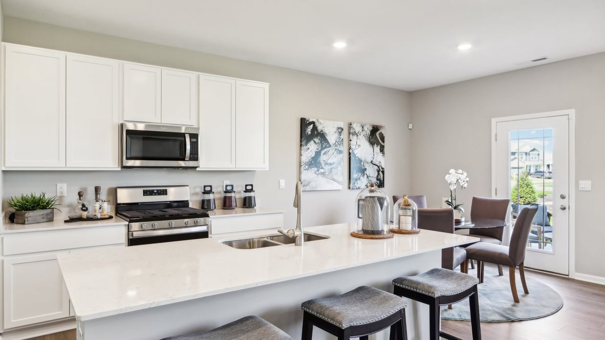 Direct head on image of the kitchen with white cabinetry