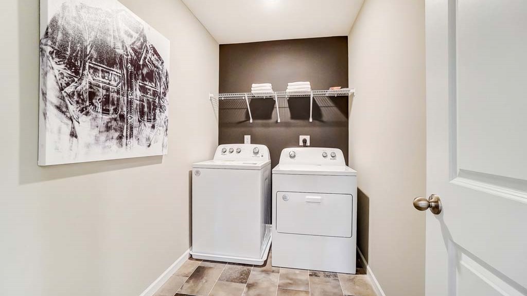 laundry room with whirlpool washer and dryer.