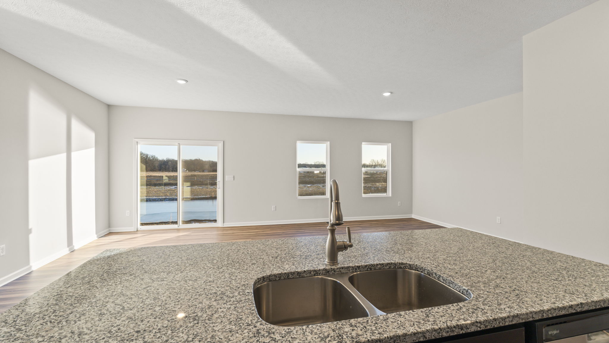 Closeup of sink in granite island