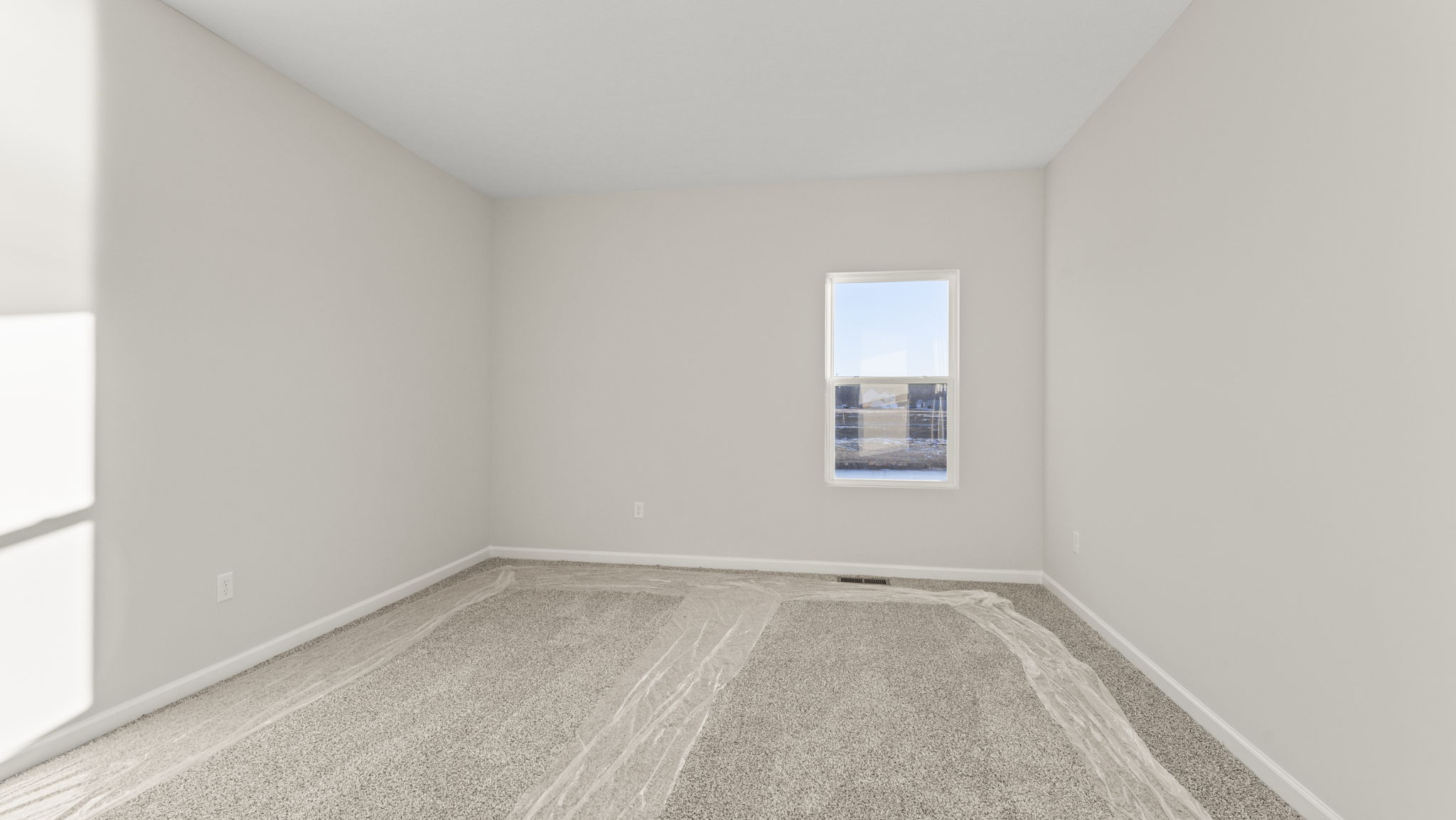 Carpeted primary bedroom