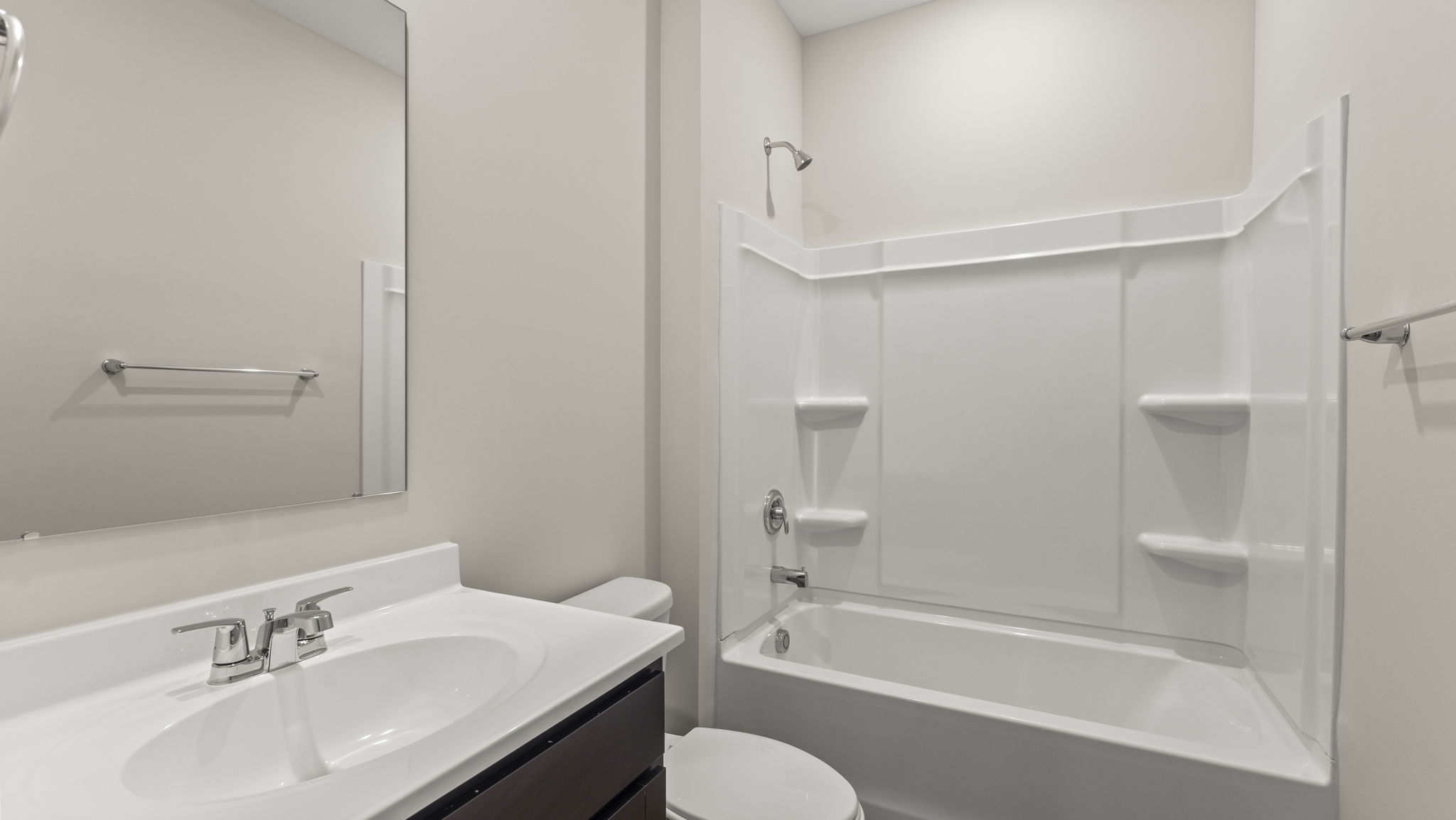 Bathroom with sink, toilet, and shower