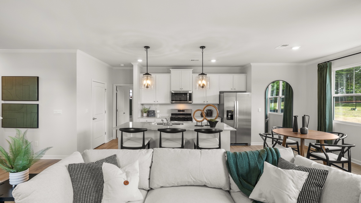 Wide image of full kitchen and great room