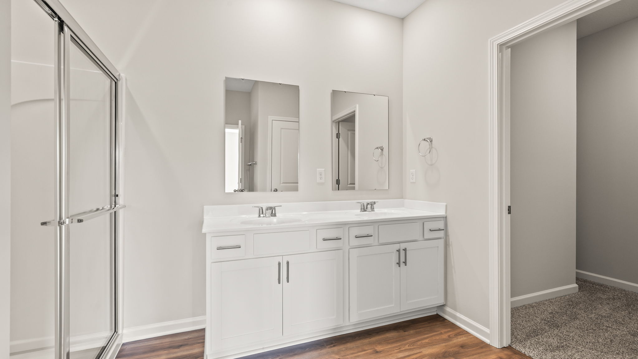 Primary bathroom suite with dual sink vanity