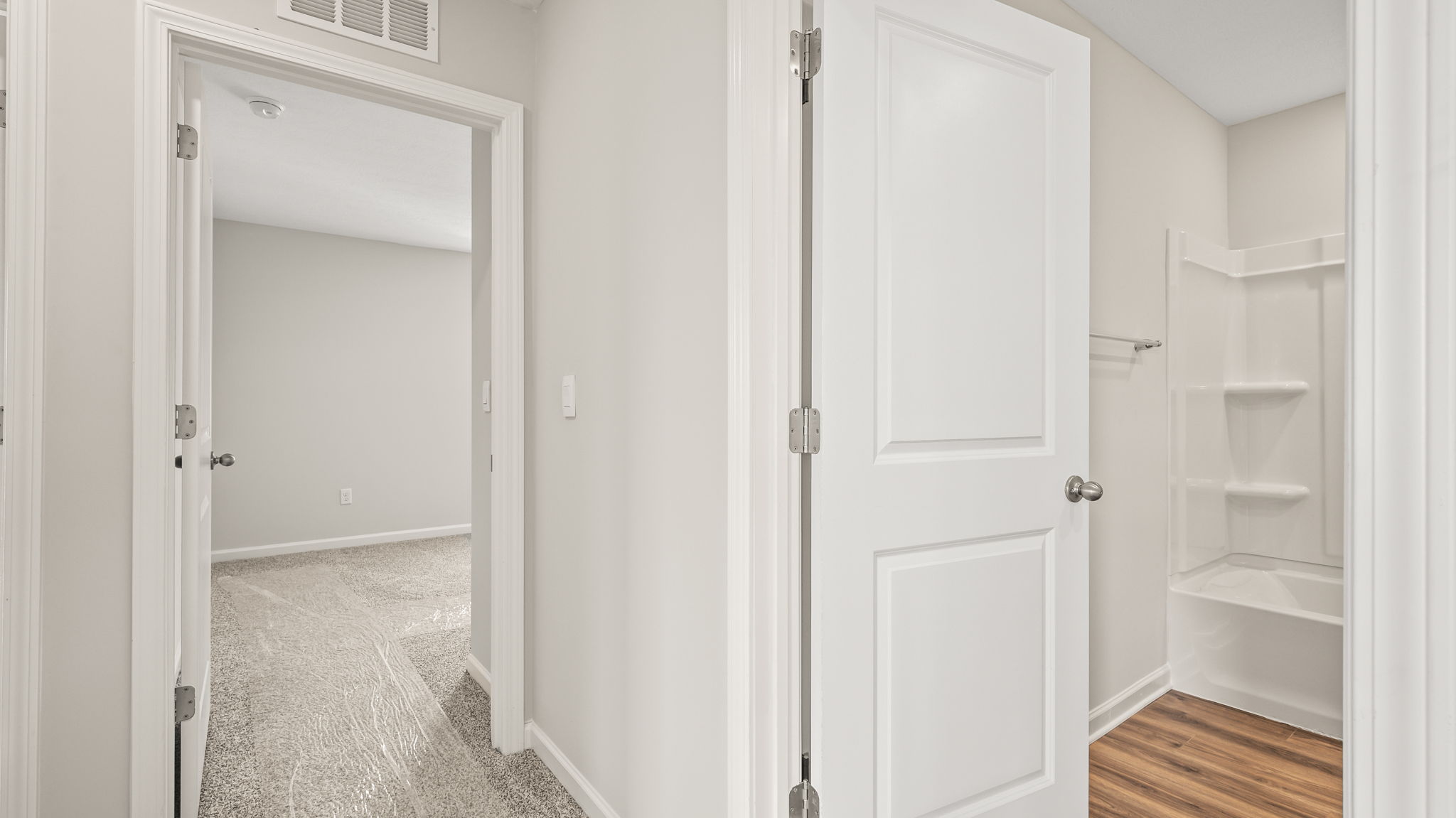 Hallway leading to bedroom and bathroom