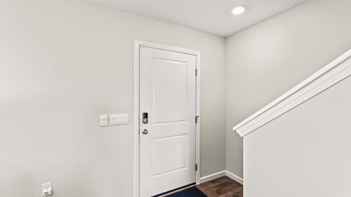 Front entryway of home with stairs as soon as you step in.
