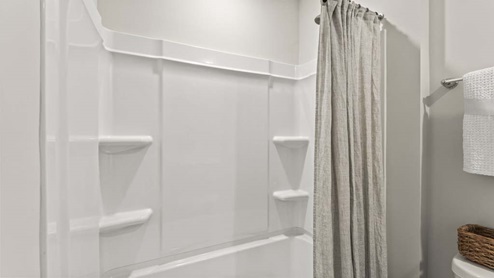 Bathroom with a step in shower.