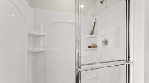 Bathroom with a walk in shower.
