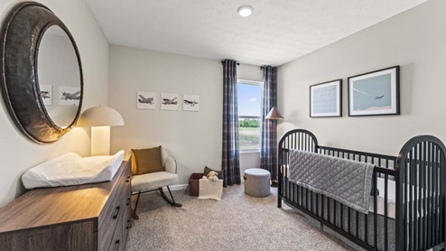 Bedroom with carpeted floors and a single window.