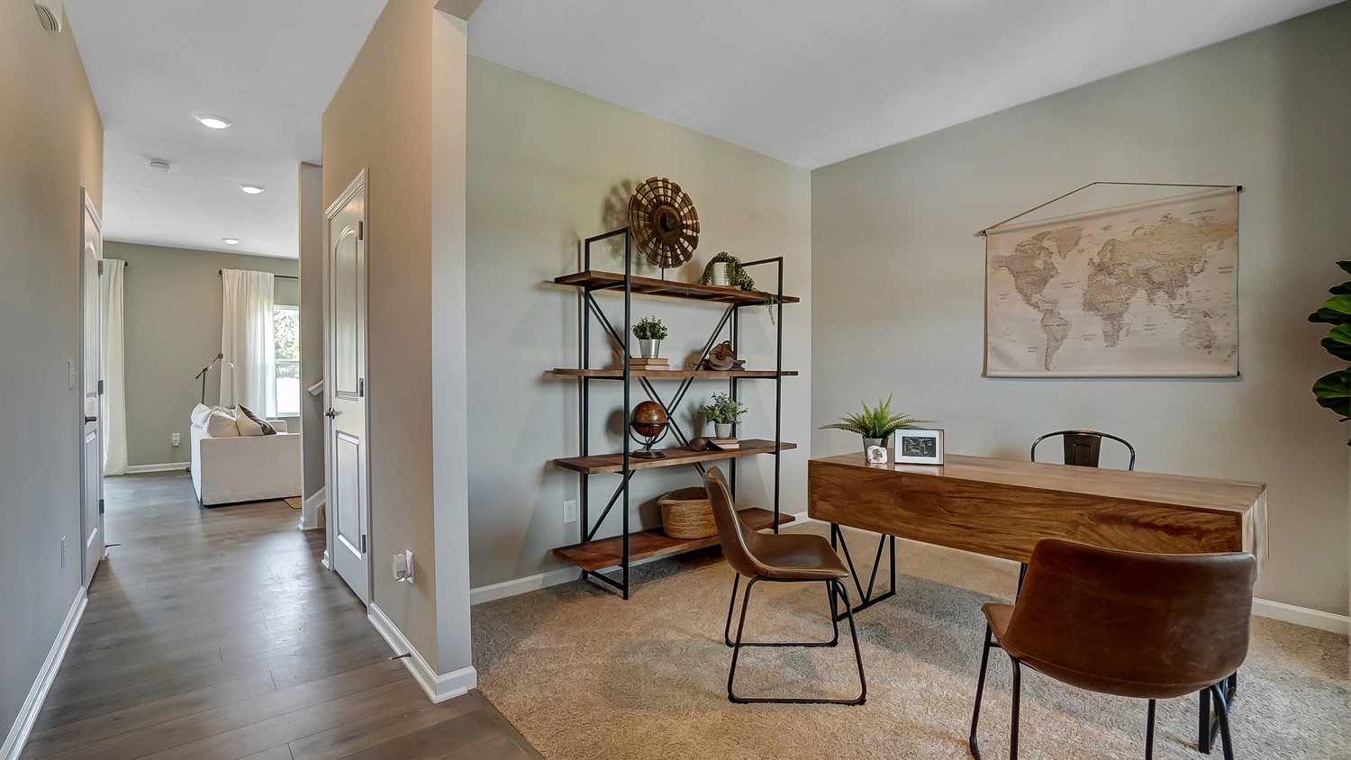 foyer with view of office and hallway leading into great room.