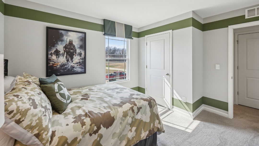bedroom decorated in military decor, featuring black wooden furniture and a window