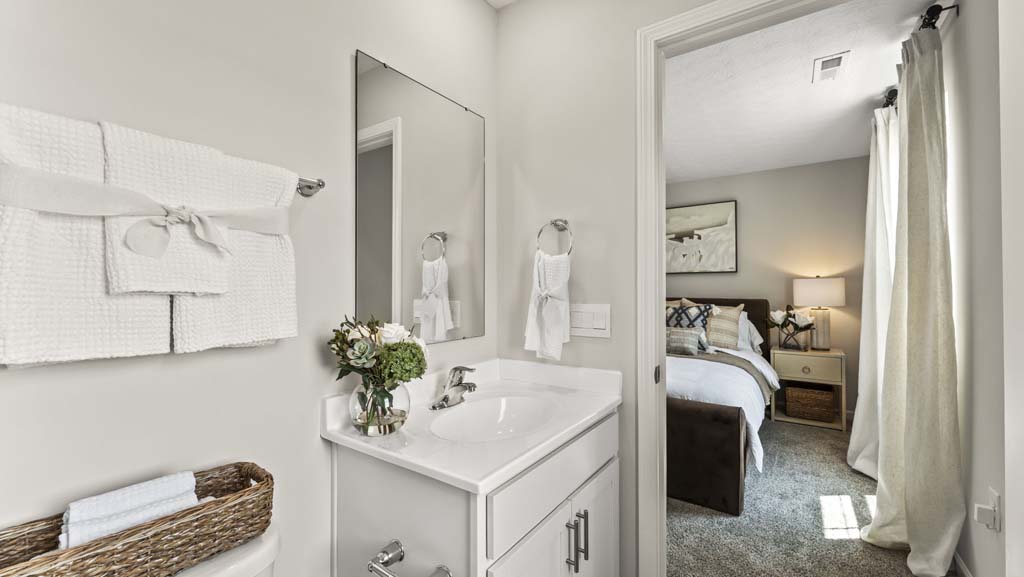 Primary bathroom with sink and mirror