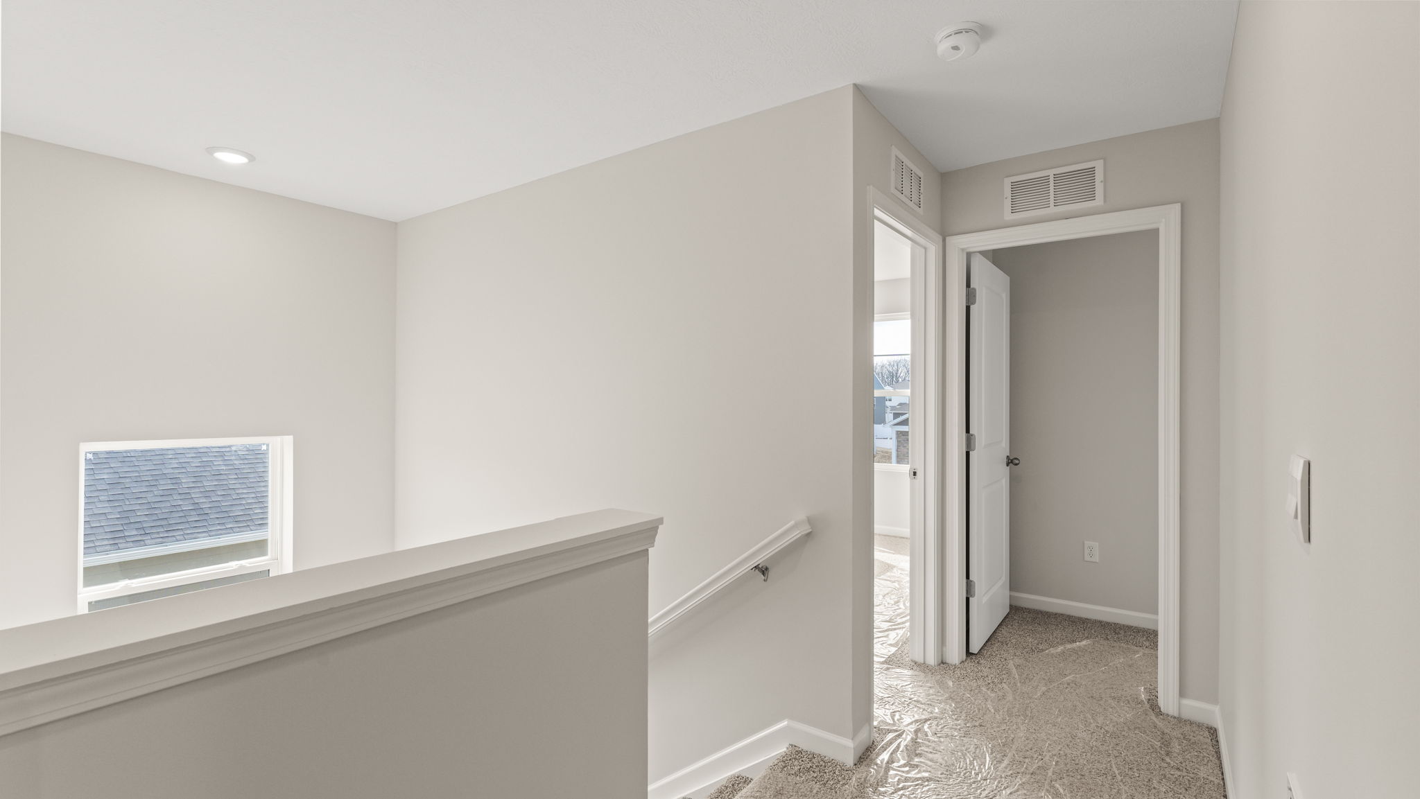 Upstairs hallway with doors to multiple other rooms