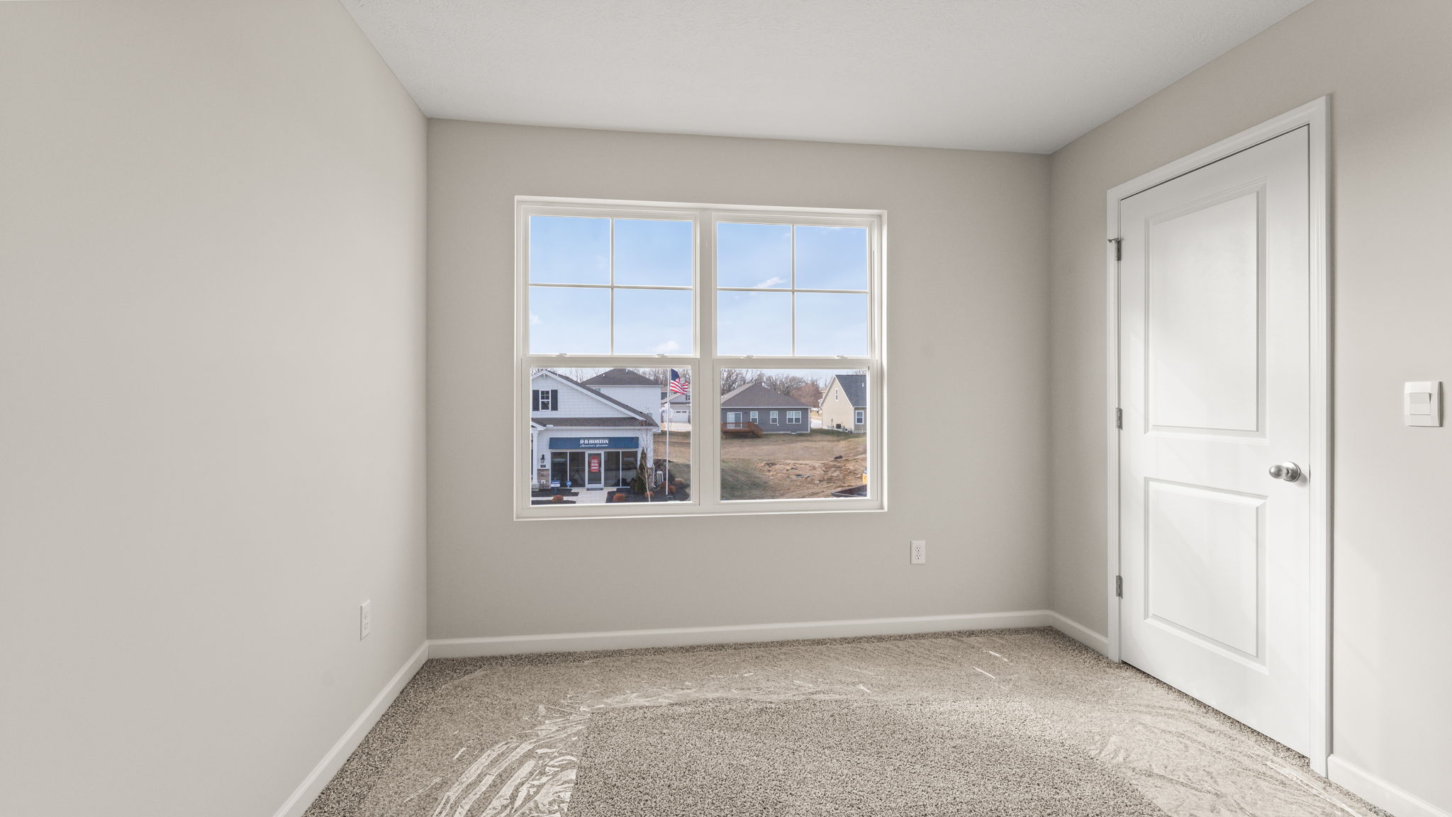 Carpeted bedroom with window
